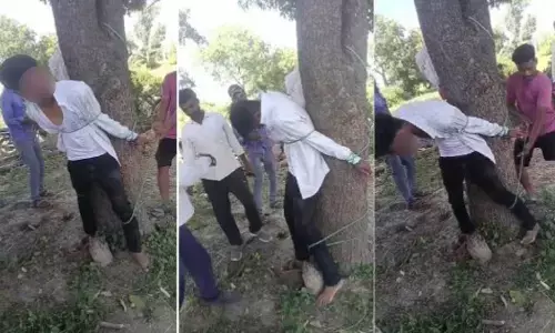 MP News : नाबालिग से छेड़छाड़ के बाद  ग्रामीणों  ने अतिथि शिक्षक की पेड़ से बांधकर की पिटाई, VIDEO वायरल